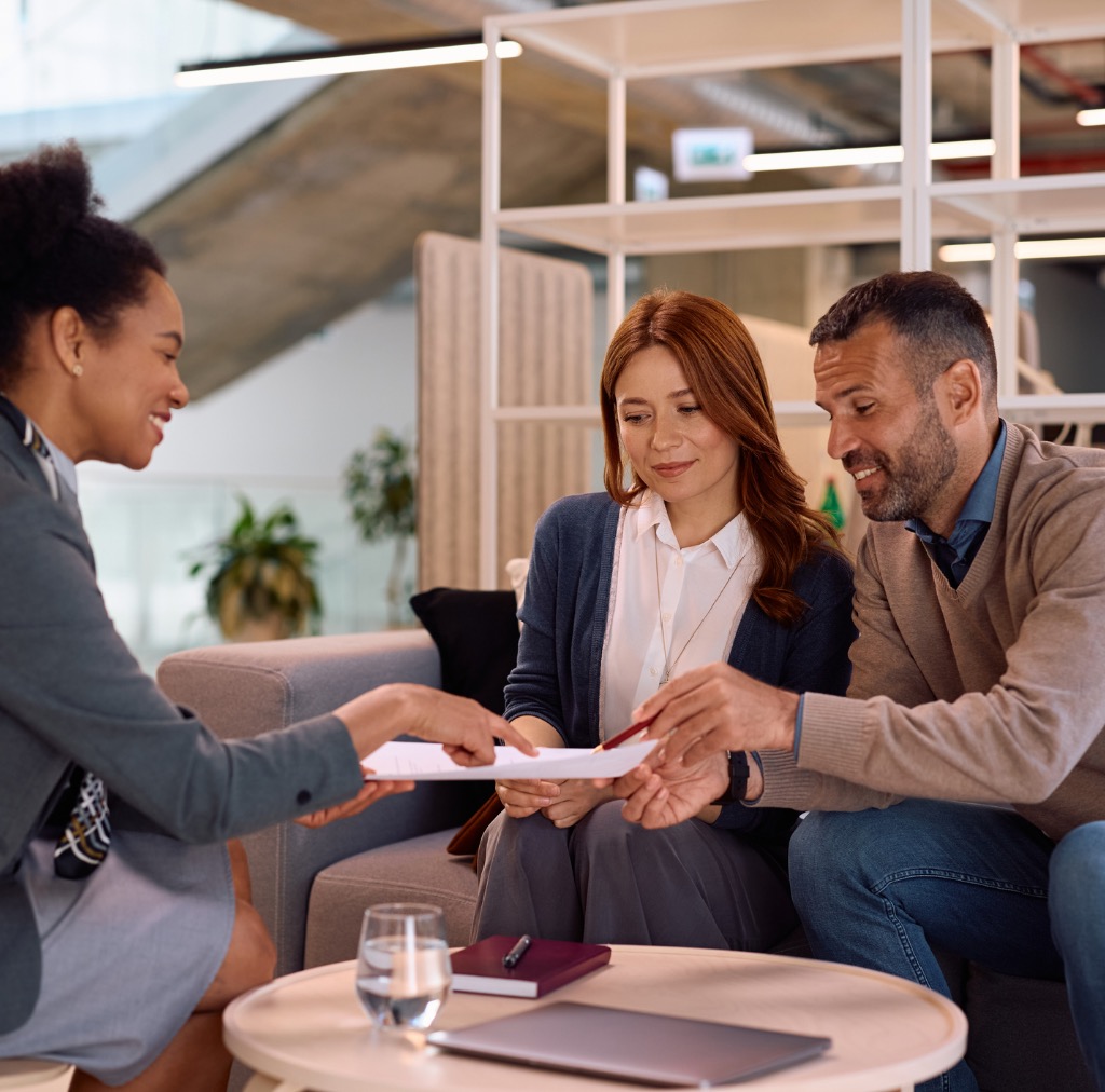Professionals collaborating in a sunlit conference room